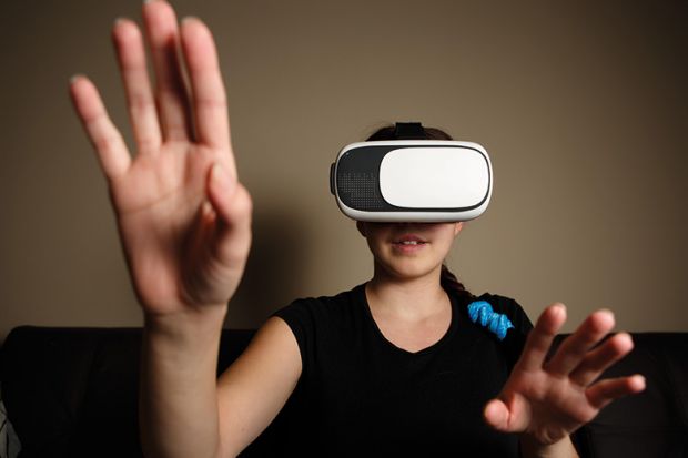 Woman wearing a virtual reality headset Woman wearing a virtual reality headset