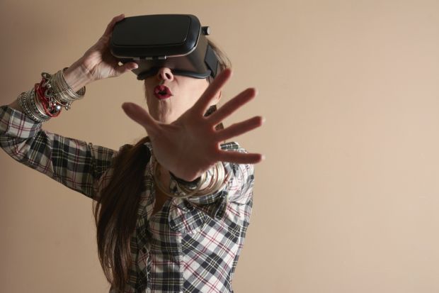 Woman using virtual reality headset