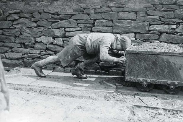 worker-pushing-cart worker-pushing-cart