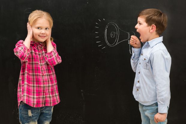 Young boy shouting at girl covering ears Young boy shouting at girl covering ears