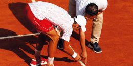Novak Djokovic of Serbia inspects a line call with the umpire to illustrate Norwegian universities fear EU exclusion under technology rules