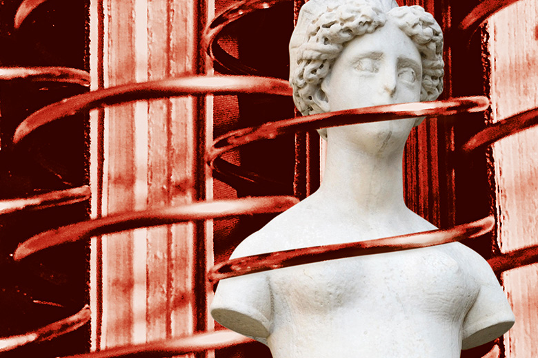 A statue wrapped in red wire A statue wrapped in red wire