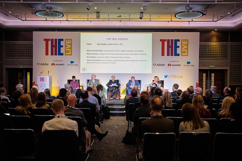 Speakers on stage at a THE Live event