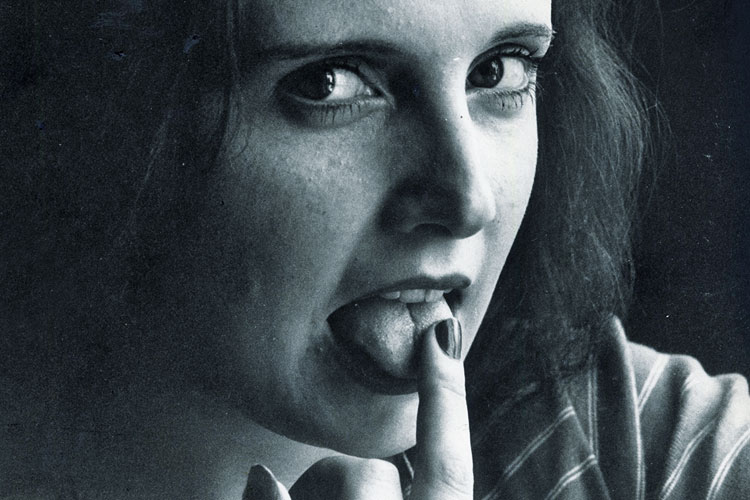 Woman licking her finger Woman licking her finger